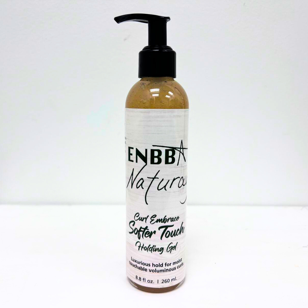 A pump bottle of Curl Embrace Softer Touch Holding Gel by ENBB Naturals, with a white label and black text.