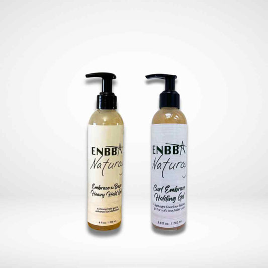 Two bottles of ENBBA Natural hair care products on a white background
